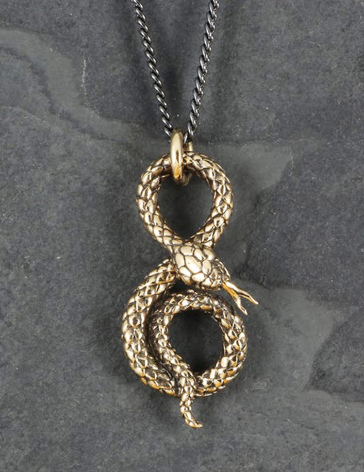 Collier serpent enroulé en bronze, entièrement travaillé à la main par Lost Apostle! Vendu chez Tah-dah !