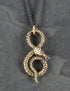 Collier serpent enroulé en bronze, entièrement travaillé à la main par Lost Apostle! Vendu chez Tah-dah !