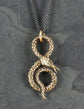 Collier serpent enroulé en bronze, entièrement travaillé à la main par Lost Apostle! Vendu chez Tah-dah !