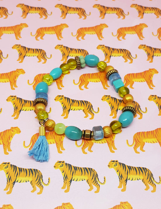 Bracelet funky bille en plastique turquoise. Vendu chez Tah-dah ! 