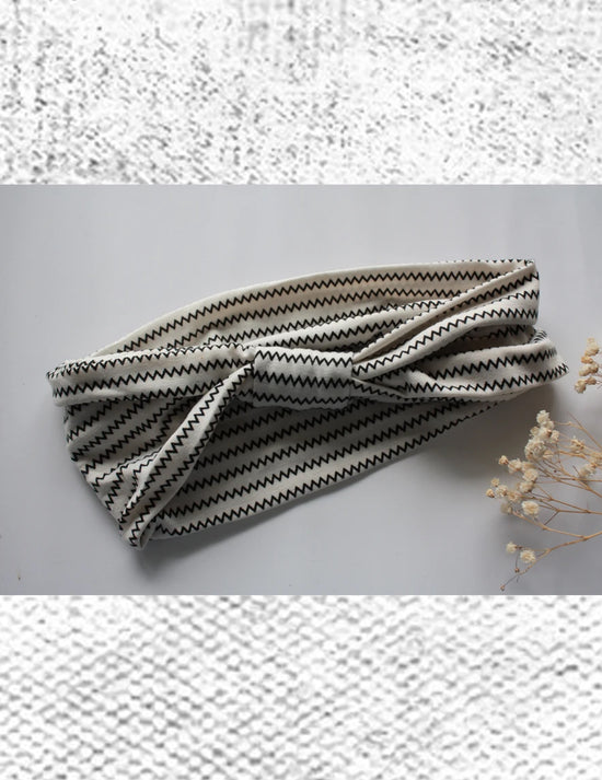 Super bandeau pour toutes les occasions.  Noir et blanc. Vendu chez Tah-dah ! 